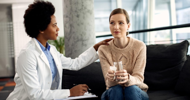 Therapist comforting a patient in a session.